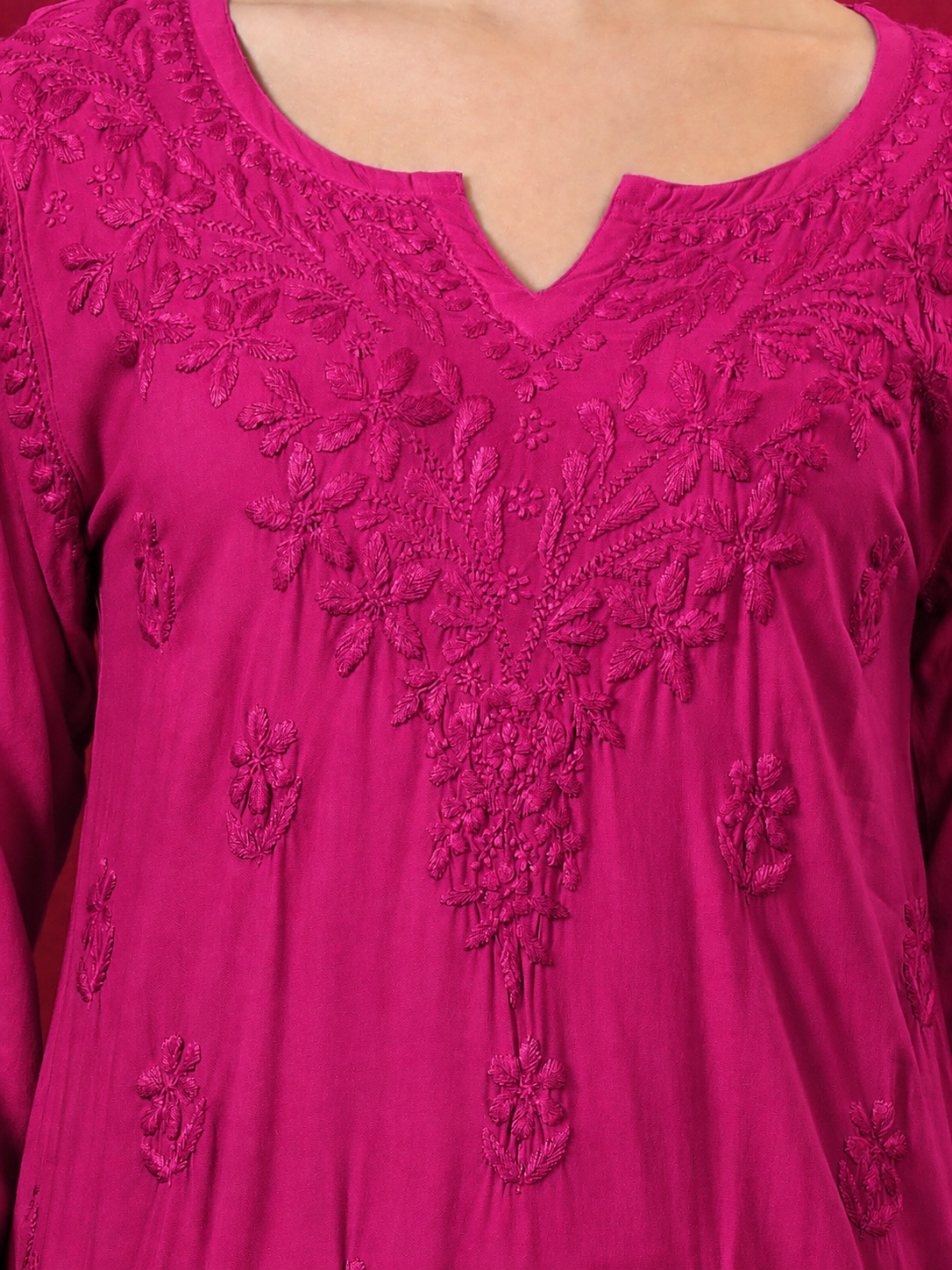 Elegant women’s rayon short kurti with traditional Chikankari embroidery, floral motifs and a relaxed fit, ideal for college, office, shopping and casual everyday wear.