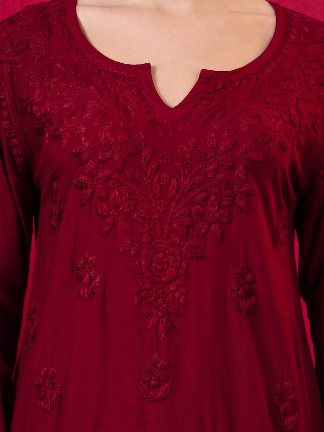 Stylish short Chikankari kurti for women featuring traditional embroidered floral motifs, soft rayon fabric, full sleeves and a comfortable silhouette for daily wear.