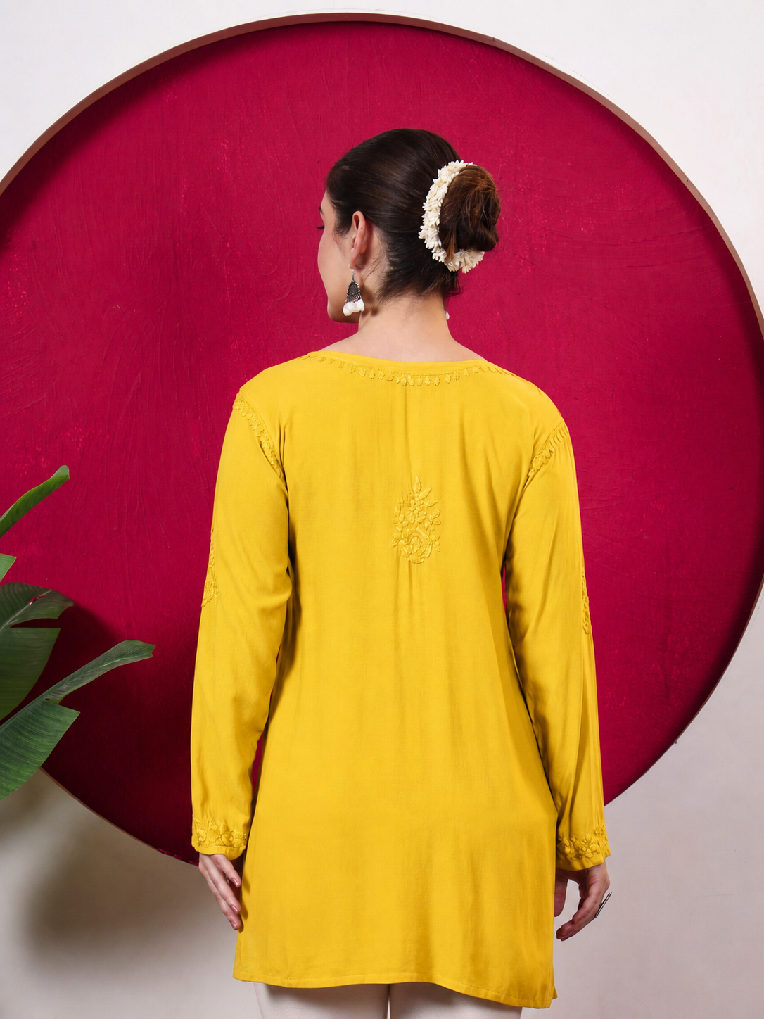 Women’s Chikankari top in soft rayon fabric with intricate floral embroidery across the neckline, front, sleeves and hem, designed as a stylish and comfortable regular wear kurta.