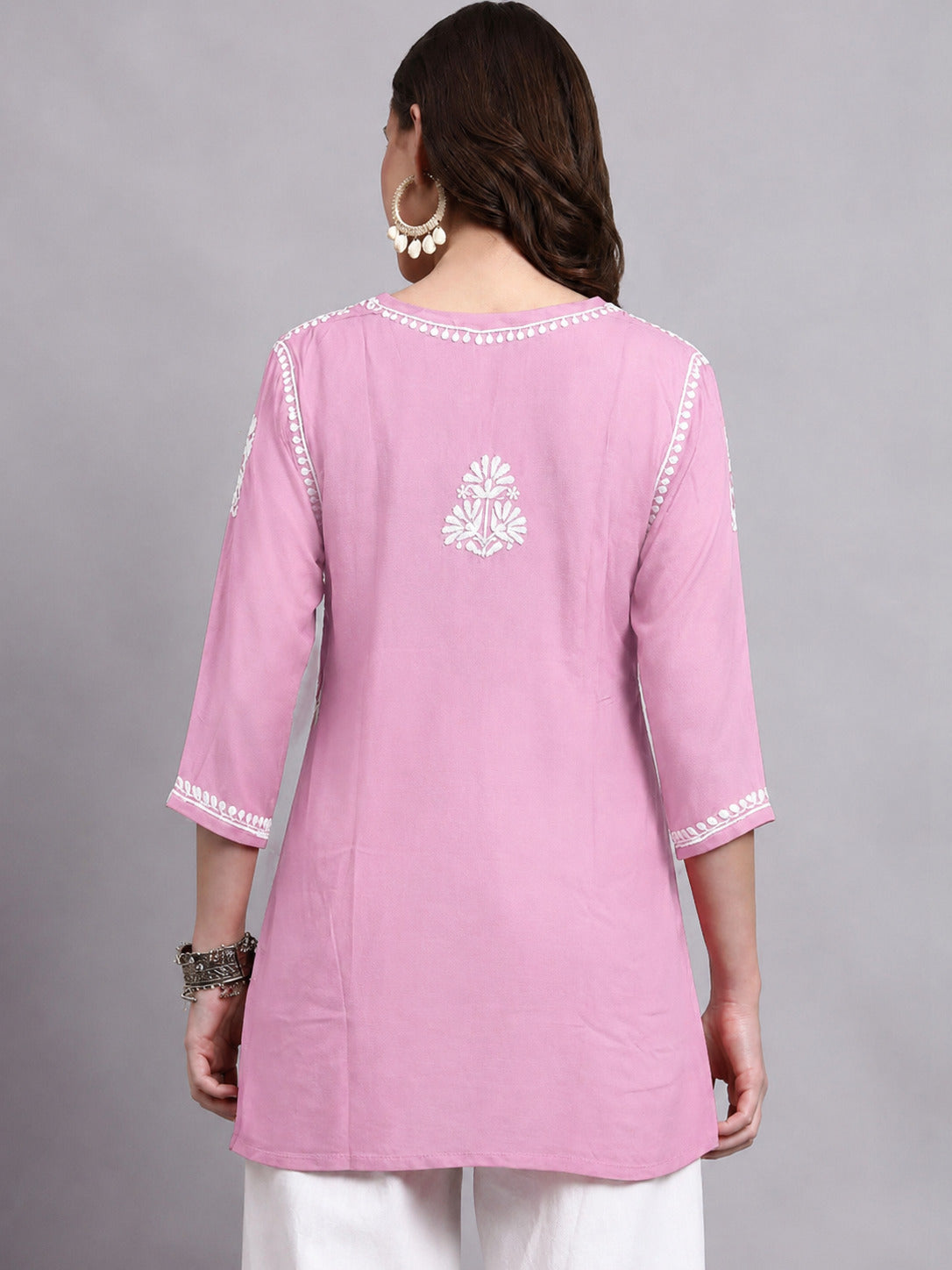 Stylish Chikankari short kurti for women featuring intricate embroidery, lightweight rayon fabric and a relaxed silhouette suitable for office, college and day outings.