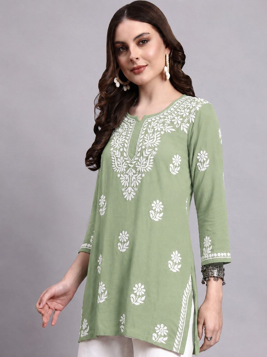 Elegant Sirat Rayon Short Top for women with detailed Chikankari work around the neckline and sleeves, designed as a comfortable regular wear top.