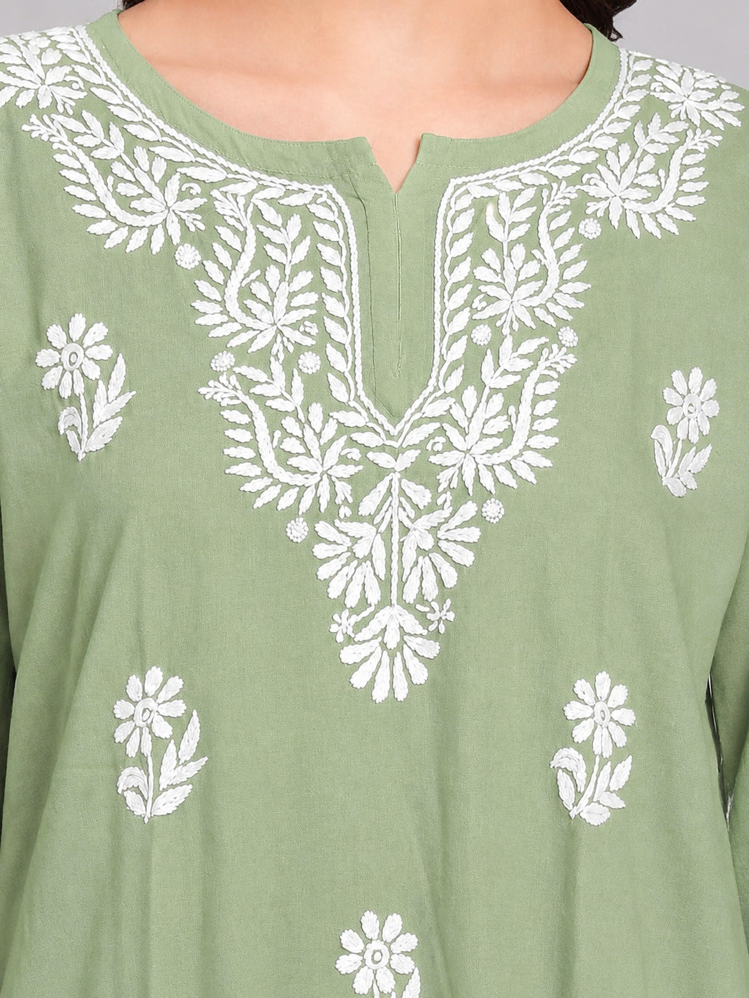 Trending short kurta for women with intricate floral Chikankari embroidery, soft rayon fabric and a versatile silhouette for everyday and casual styling.
