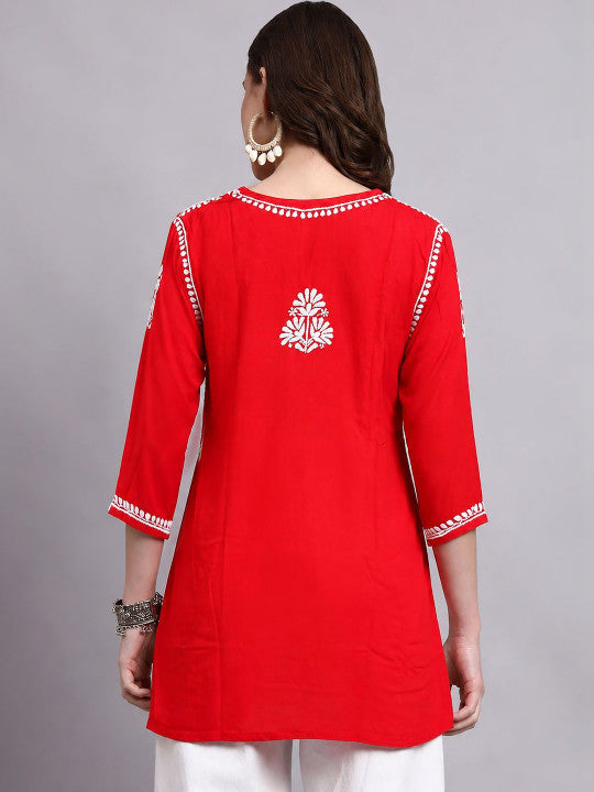 Chikankari short kurti for women designed in lightweight rayon fabric with embroidered neckline, floral motifs and 3/4 sleeves for comfortable regular wear.