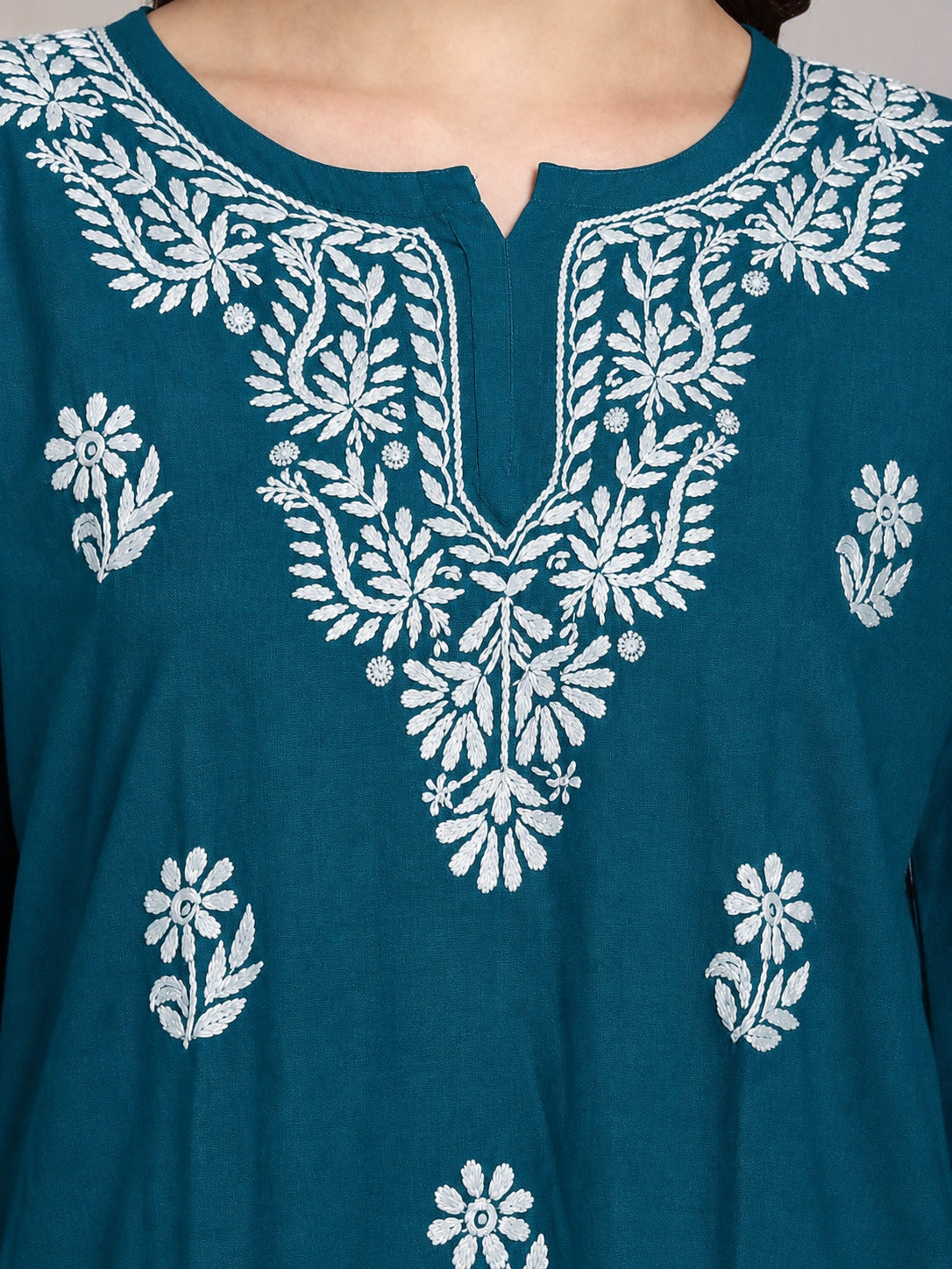 Stylish Chikankari short kurti for women featuring intricate embroidery, lightweight rayon fabric and a relaxed silhouette suitable for office, college and day outings.