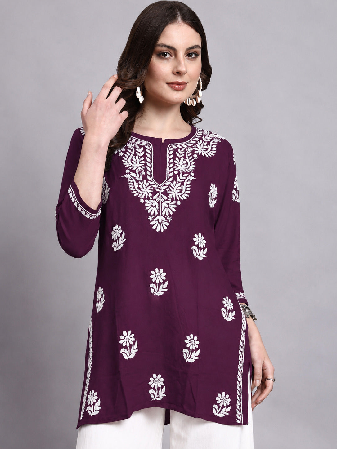 Trending short kurta for women crafted in comfortable rayon fabric with detailed Chikankari embroidery and a versatile silhouette for everyday wardrobe styling.