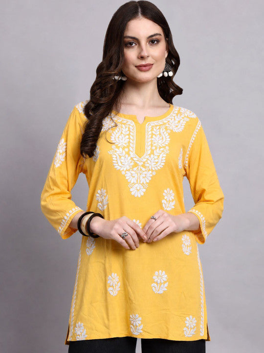 Trending short kurta for women with intricate floral Chikankari embroidery, soft rayon fabric and a versatile silhouette for everyday and casual styling.