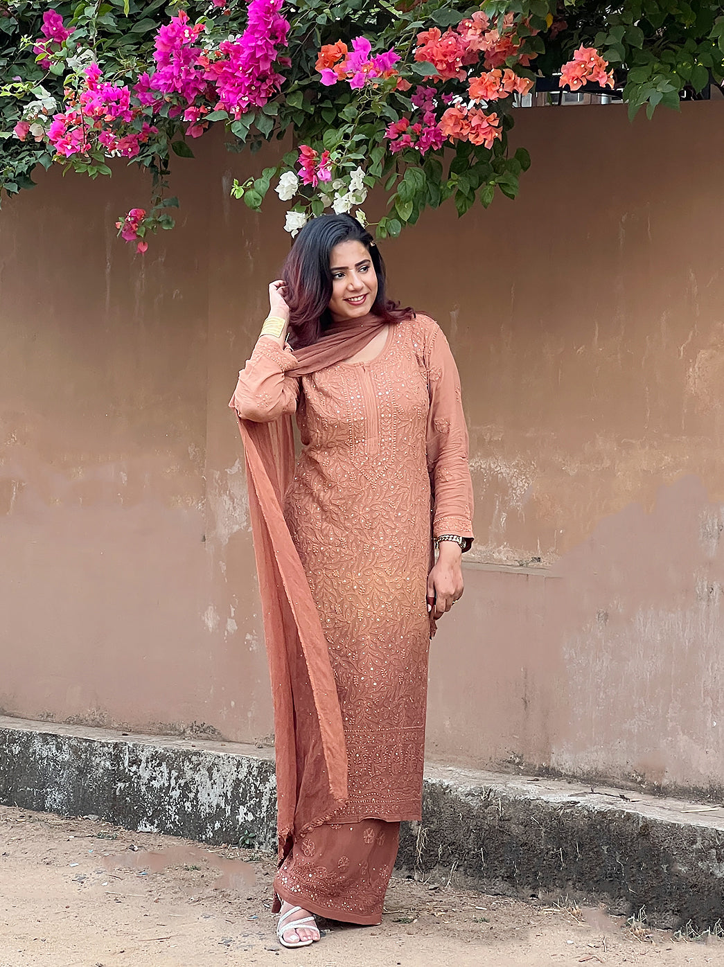 Traditional wear set featuring chikankari embroidery and lightweight dupatta styled for ethnic occasions