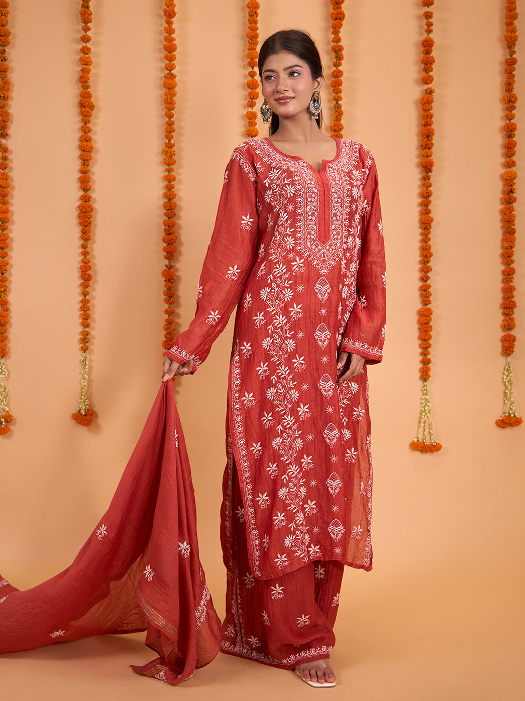 Model presenting the Sofia Mul Chanderi Kurta Set with Dupatta, highlighting the long floral embroidery panels and small motifs across the flowing palazzo pants.