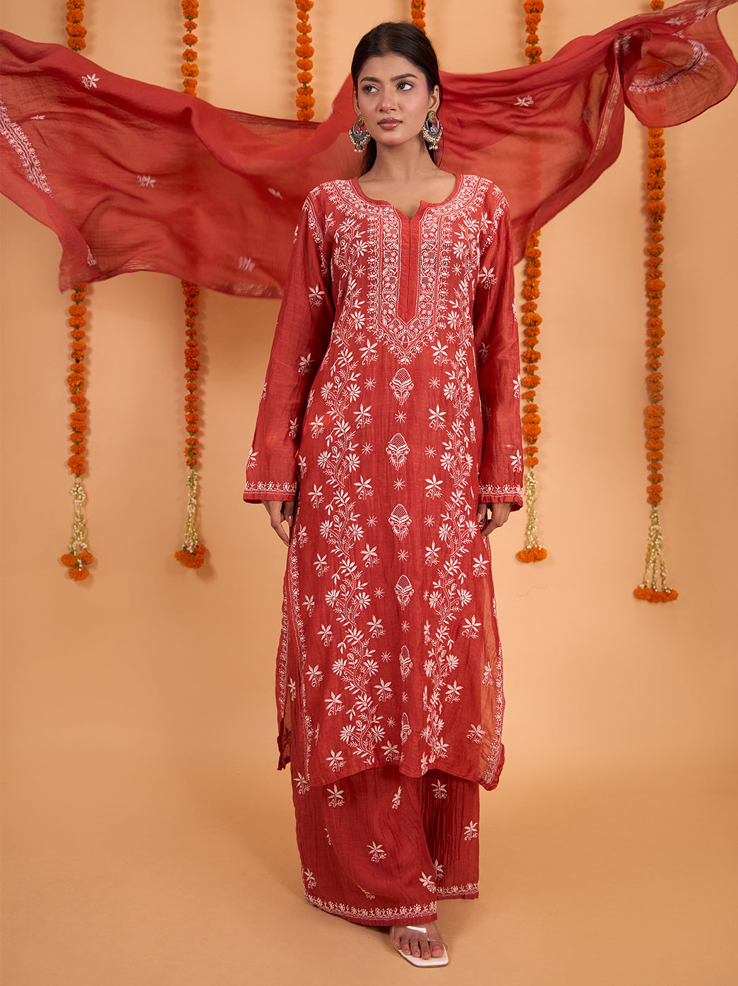 Sofia three-piece Chikankari outfit with a long straight kurta, embroidered wide-leg palazzo pants and a lightly sheer dupatta with scattered floral details.