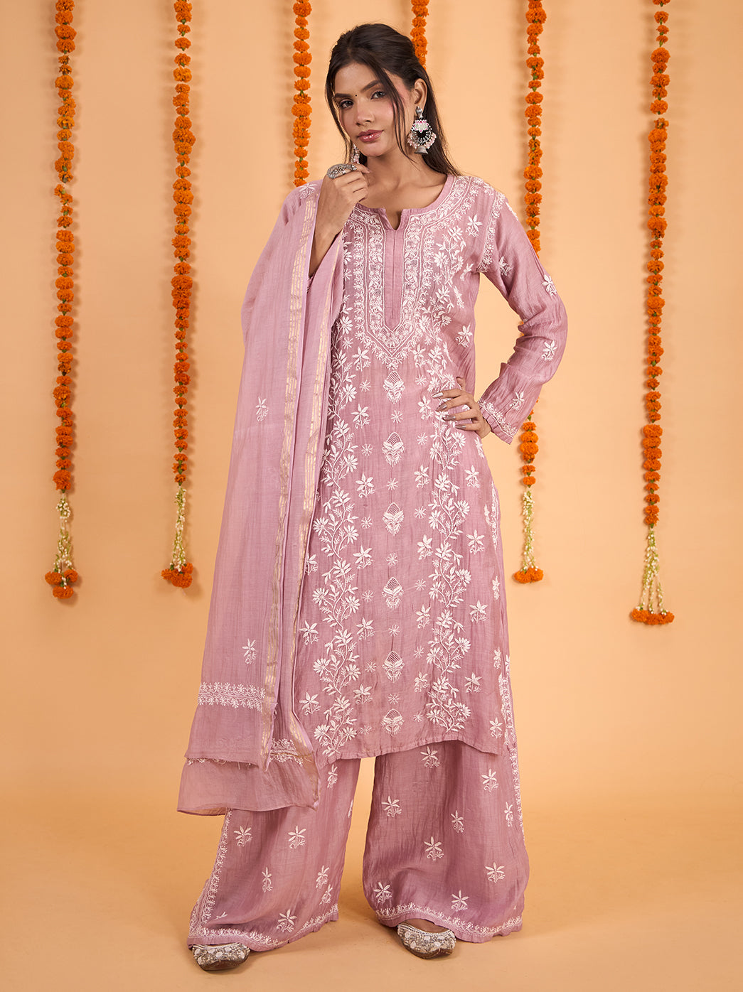 Model wearing the Sofia Mul Chanderi Kurta Set with Dupatta, featuring floral Chikankari embroidery, a long straight kurta and wide-leg palazzo pants.