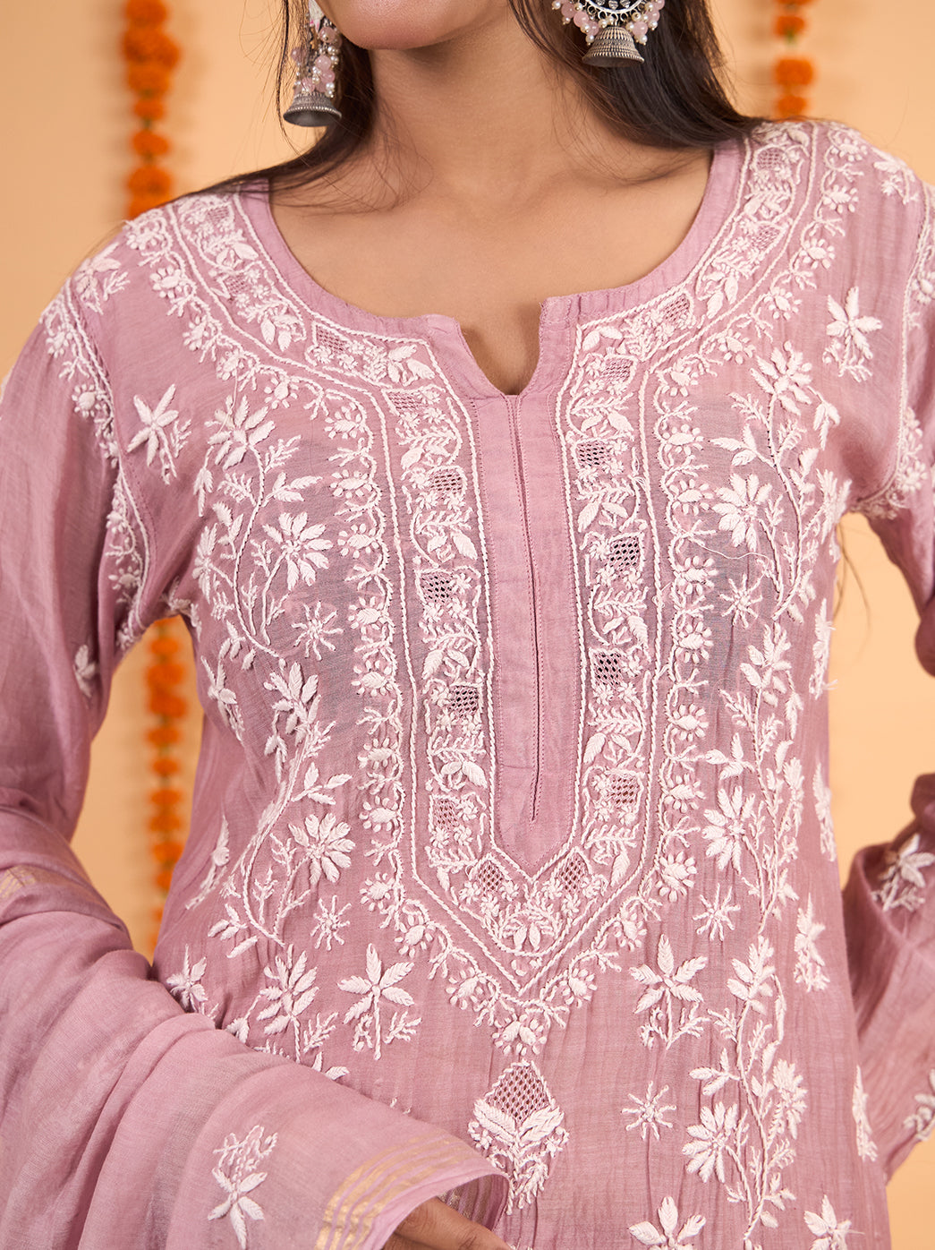 Sofia Chikankari kurta set with an embroidered rounded neckline, slit detail and full-length sleeves, styled with a dupatta draped over one shoulder.

