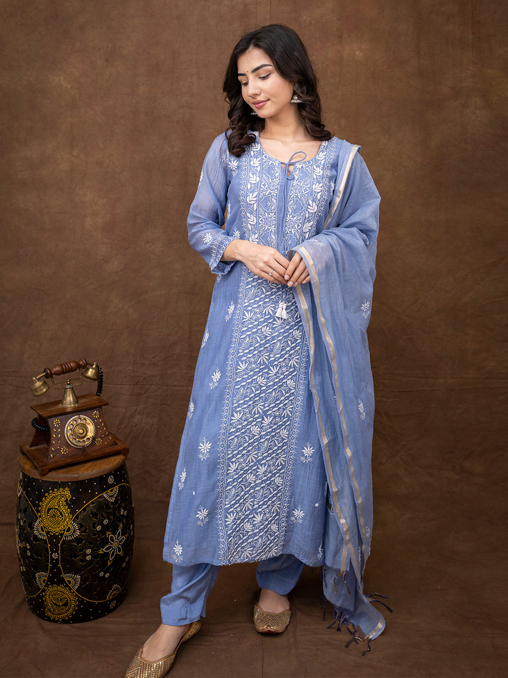Model wearing handcrafted chikankari traditional wear set suitable for pujas and family functions