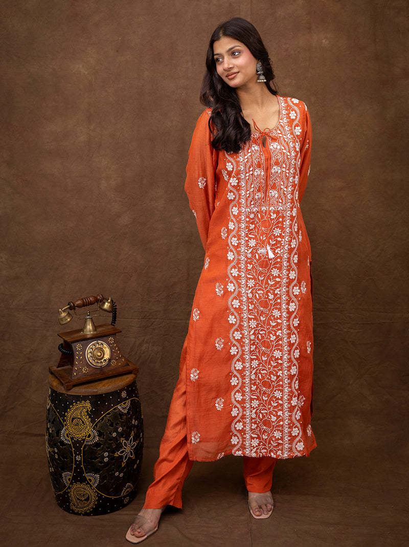 Woman wearing Sofiyana Mul Chanderi chikankari kurta set with dupatta featuring intricate hand embroidery and traditional straight silhouette