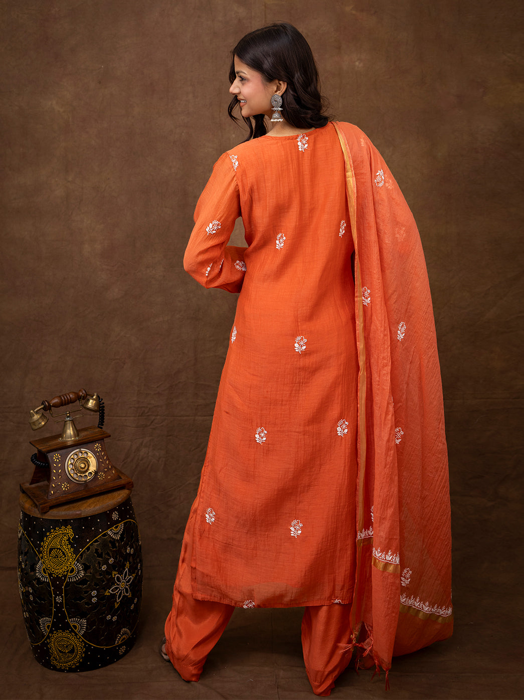 Full length view of chikankari traditional wear set designed with straight kurta and coordinated bottoms for festive occasions