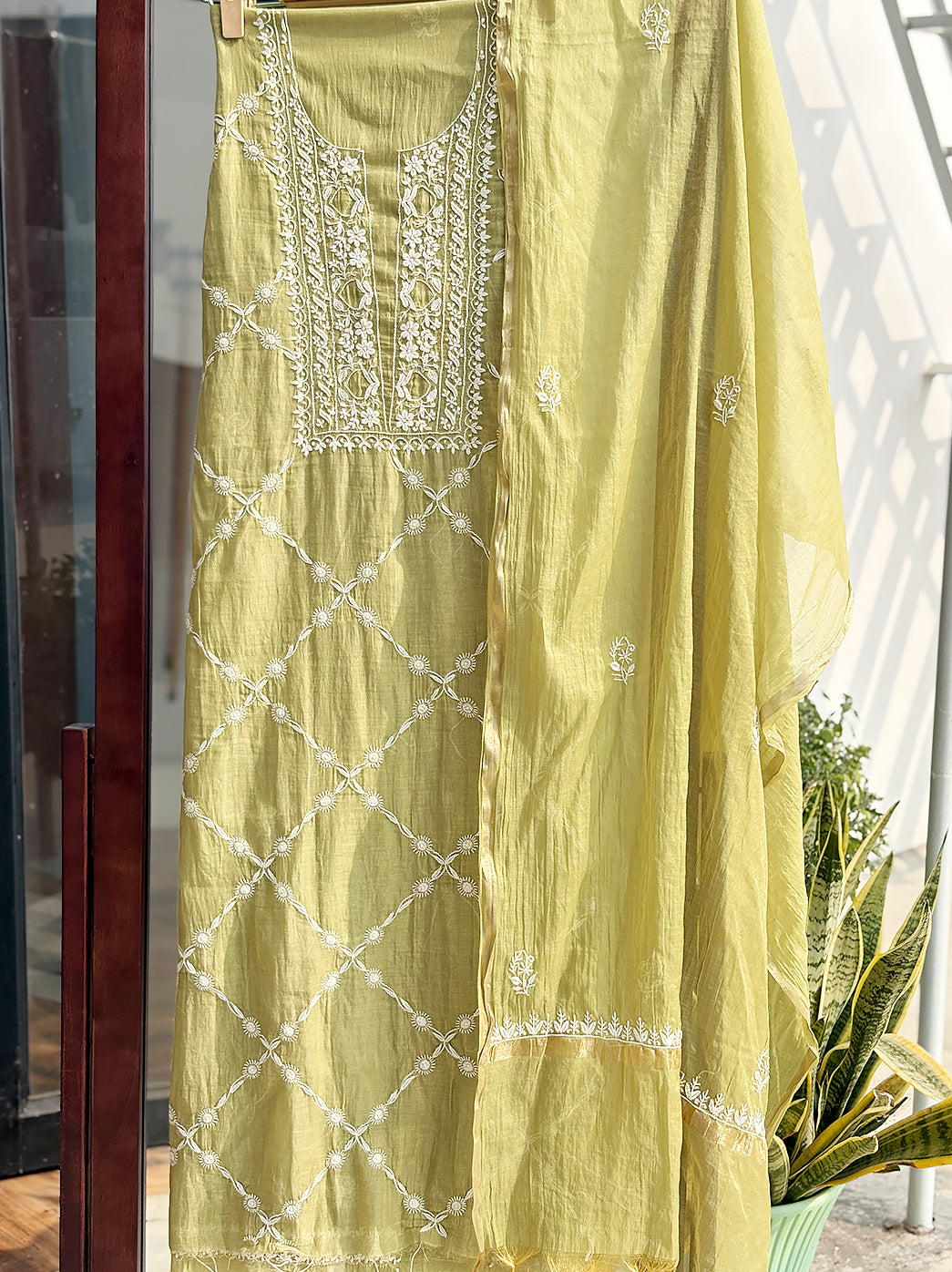 Unstitched Mul Chanderi kurti material with floral Chikankari threadwork displayed for online shopping presentation.