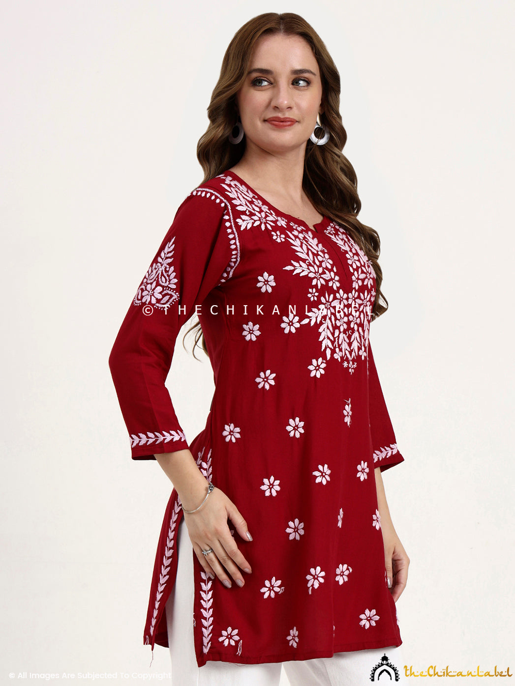 Elegant chikankari embroidered short kurti top made from breathable modal fabric.
