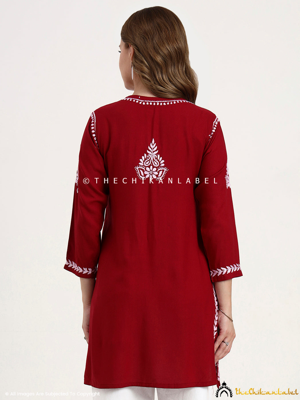 Hand-embroidered modal short kurti top featuring delicate chikankari motifs.