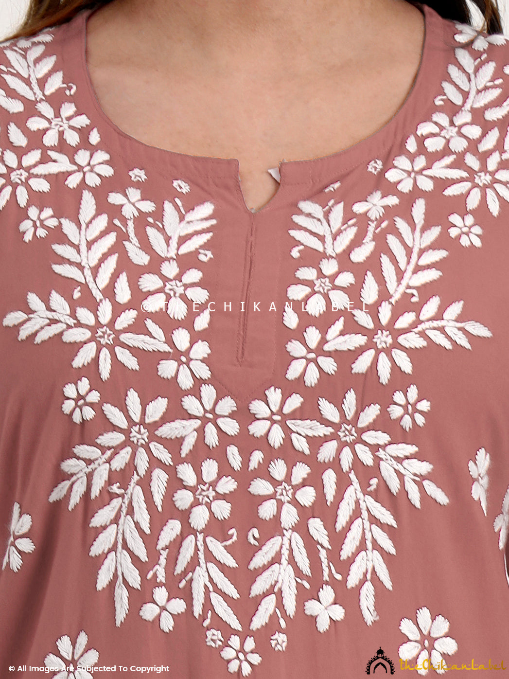 Women’s chikankari short top with authentic embroidery for a classic ethnic look.