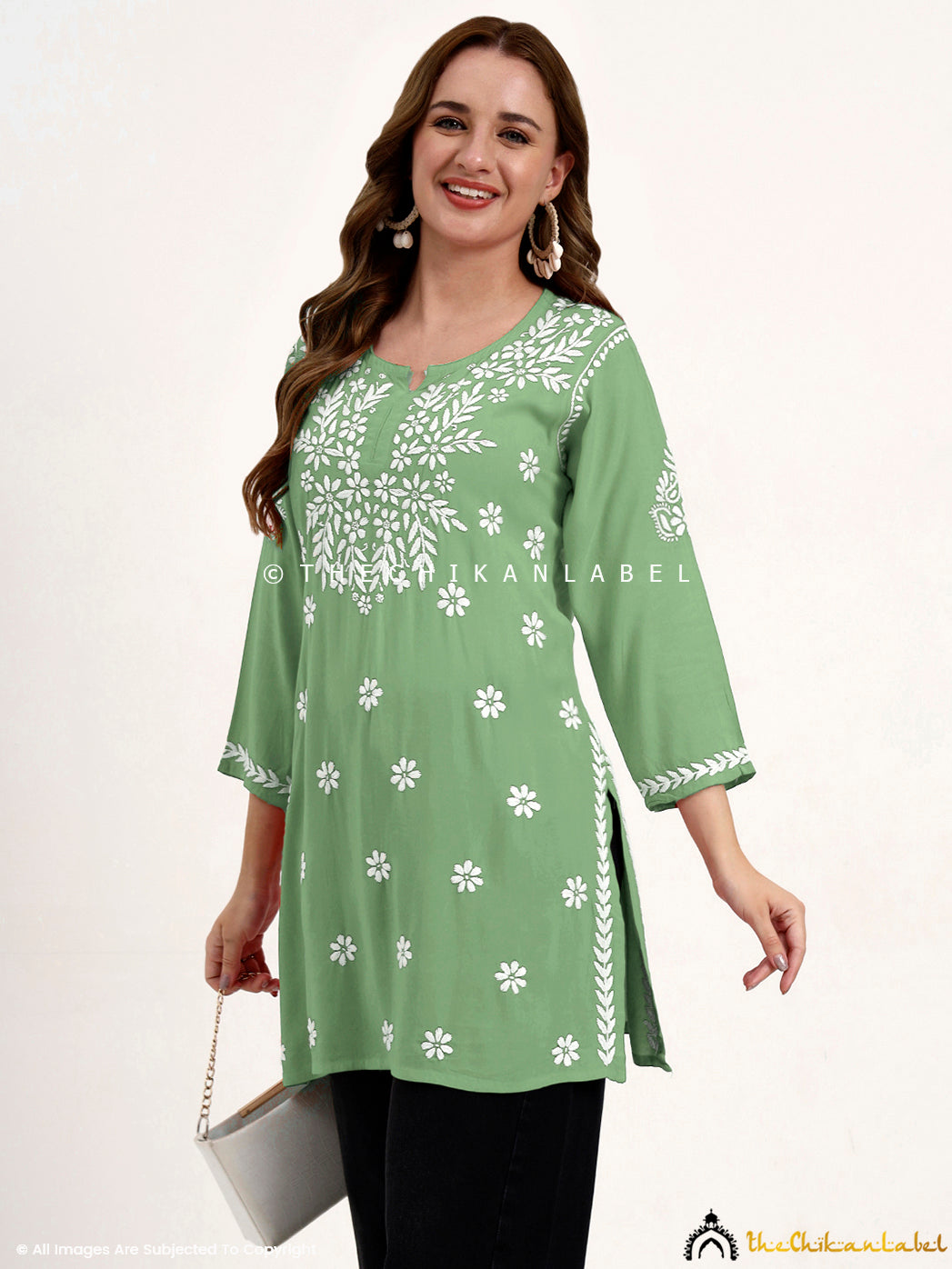 Traditional modal chikankari top with hand embroidery perfect for ethnic occasions.