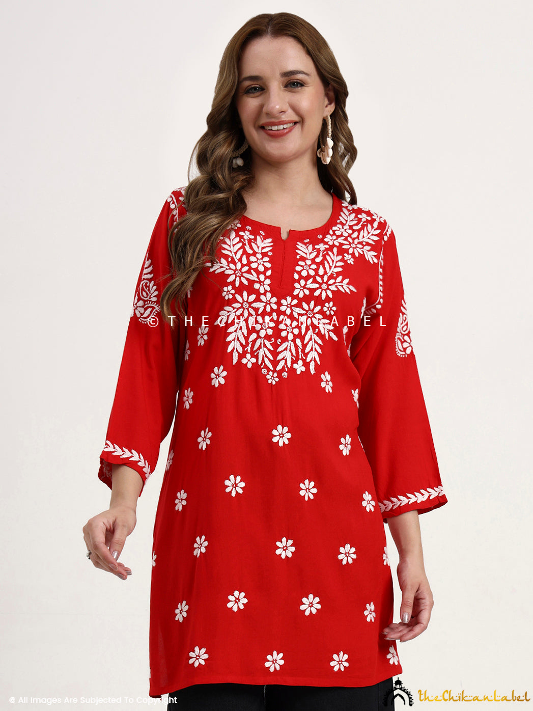 Trending women’s short kurti style top featuring modal fabric and chikankari embroidery.