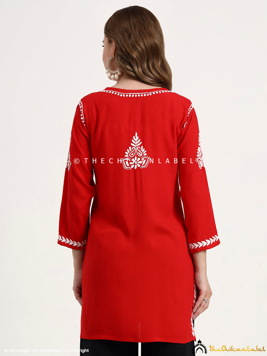 Ethnic wear chikankari top in short length crafted in modal fabric with detailed embroidery.