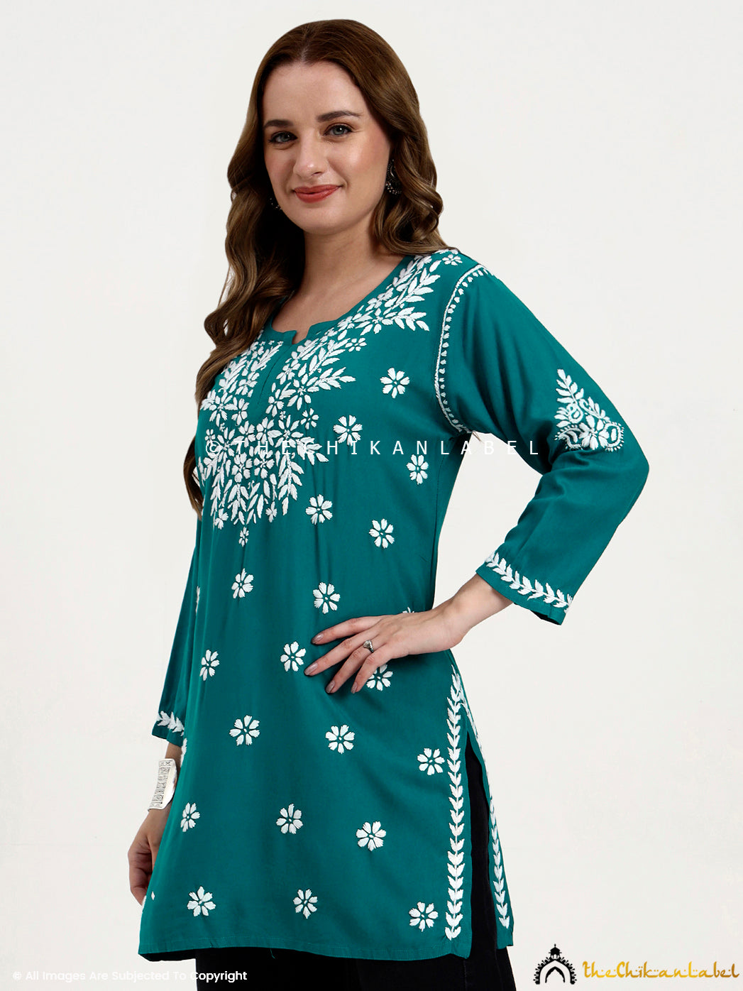 Fashionable chikankari short top for women with handcrafted embroidery details.