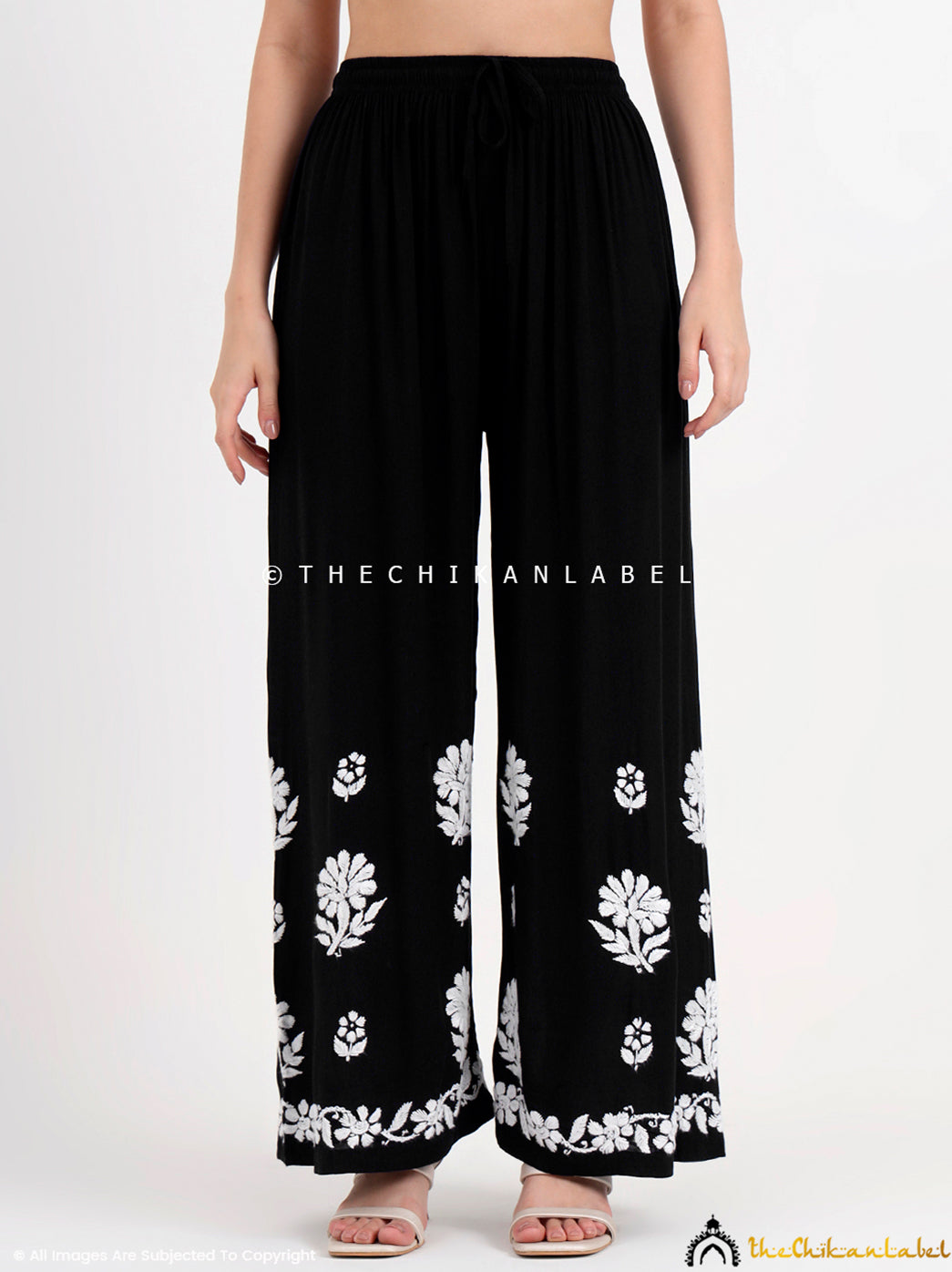 Designer chikankari modal kurti and palazzo set worn by model, perfect for those seeking a chic and modern ethnic wardrobe.

