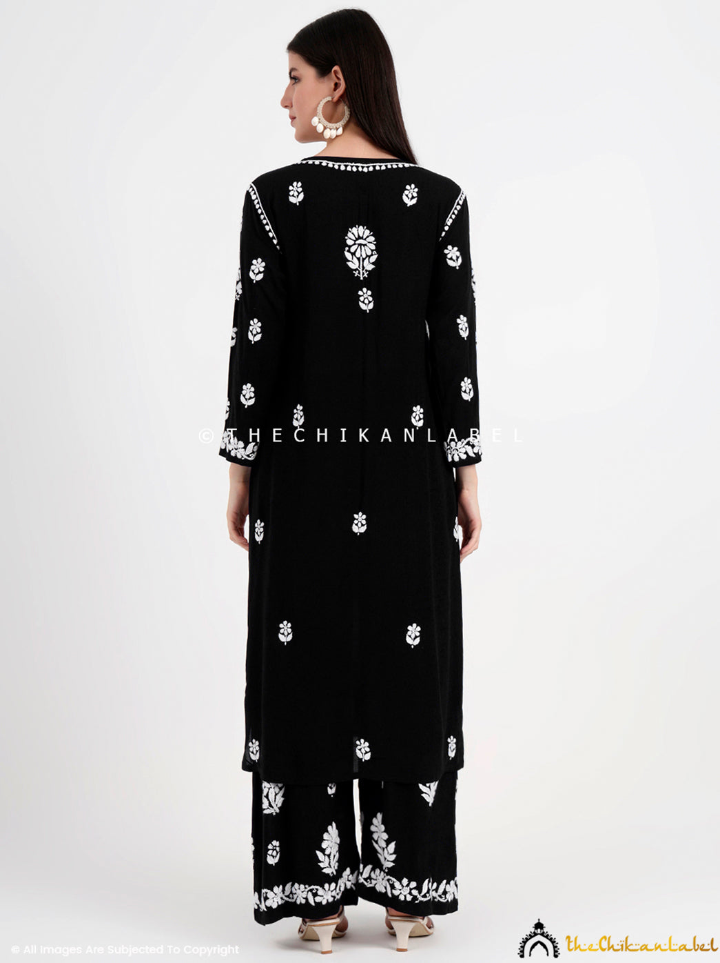 Close-up of viral chikankari modal kurti with delicate embroidery, paired with comfy palazzo for a trendy and graceful look.

