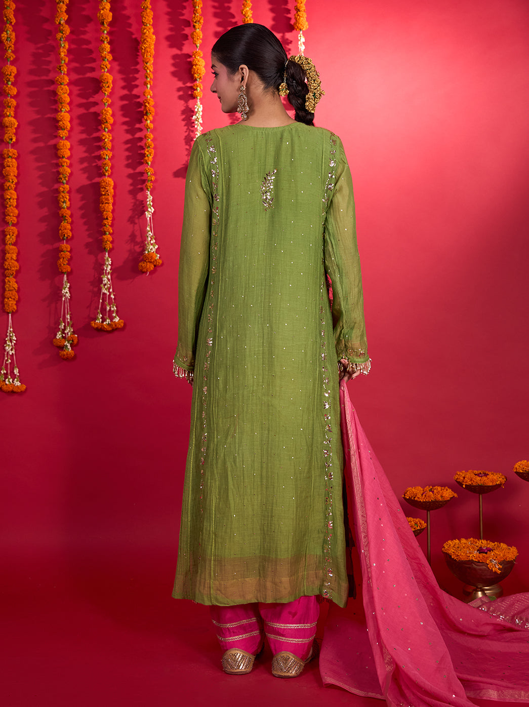 Model displaying the Tehzeeb Mul Chanderi Kurta Set with Dupatta, with a rounded slit neckline, full-length sleeves and intricate embroidery across the front.