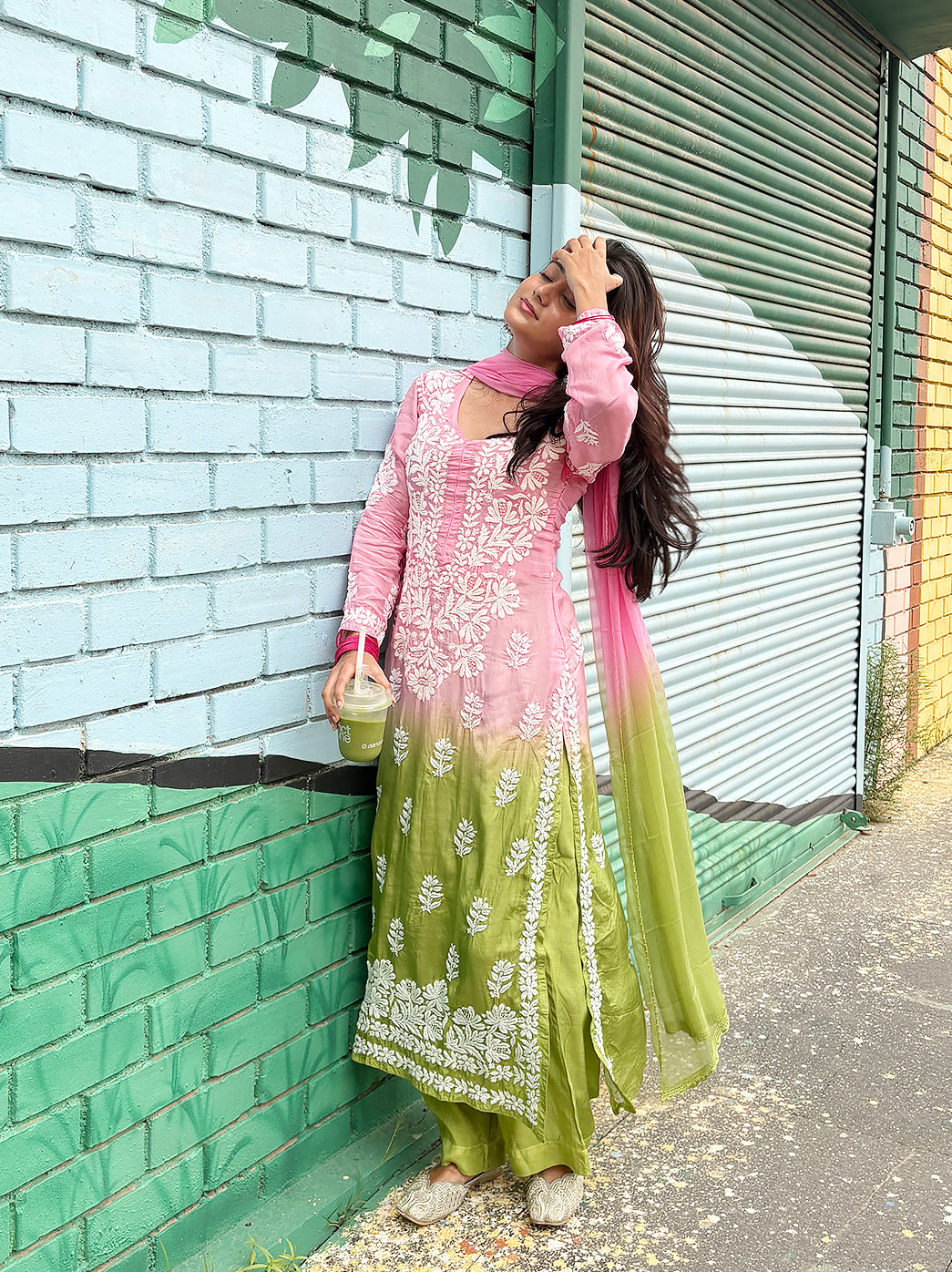 Muslin straight kurta set for women with intricate Chikankari work across the neckline, front panel, sleeves and hem, paired with matching trousers and dupatta.