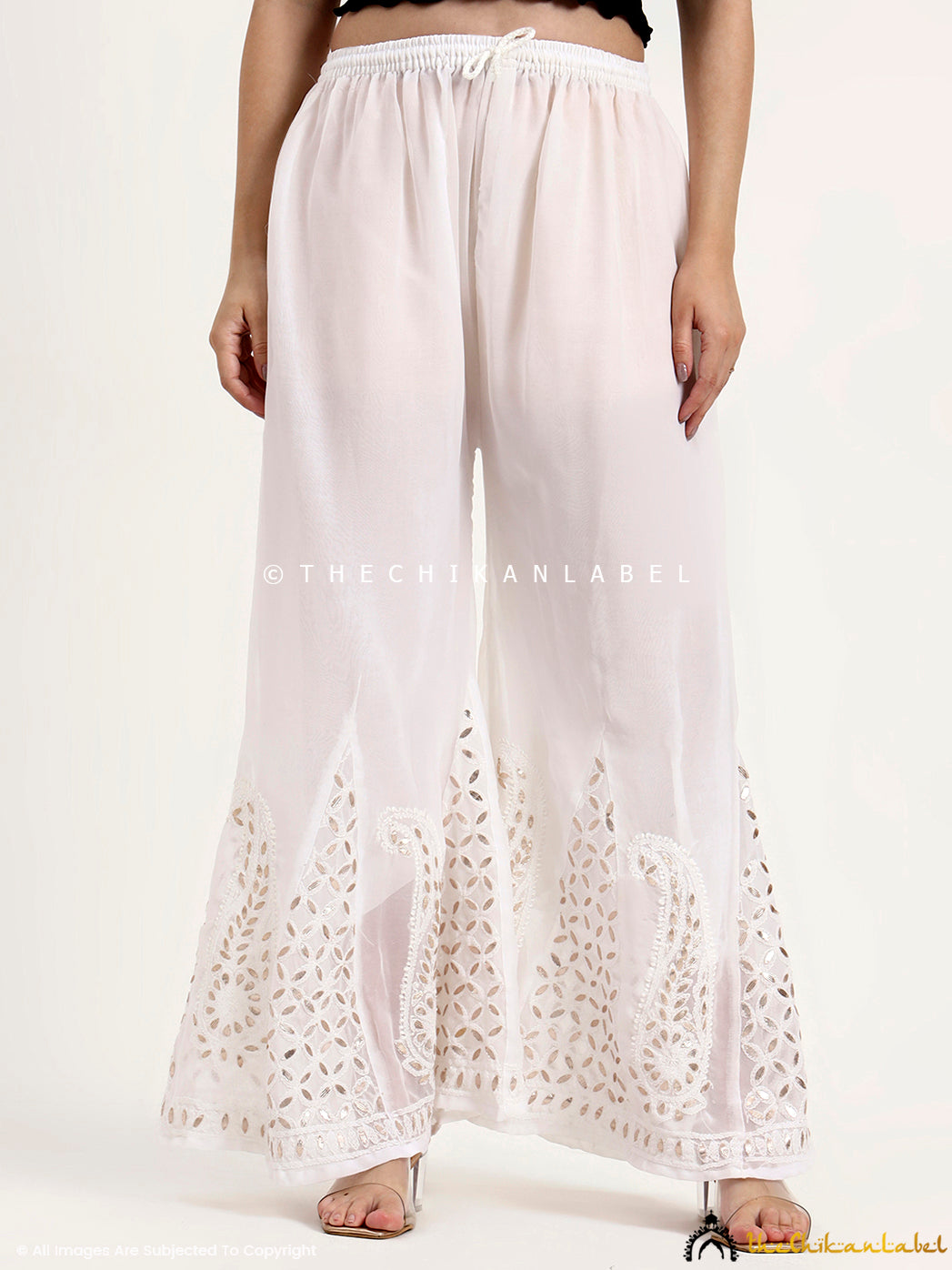 Handcrafted chikankari sharara with delicate motifs and premium georgette fabric.