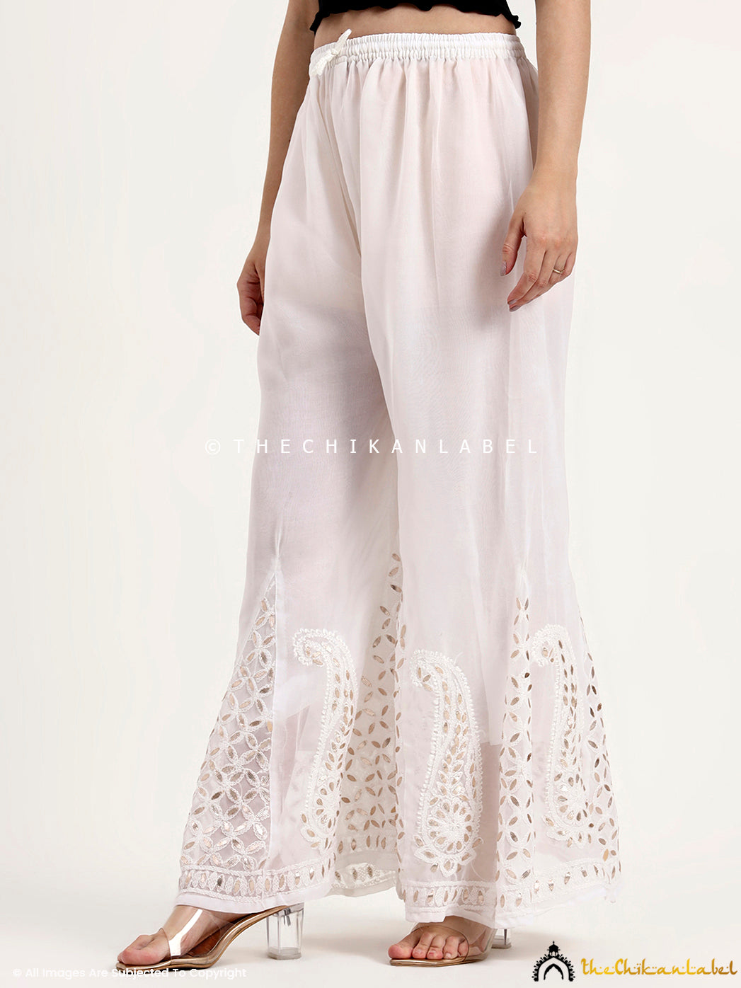 Georgette chikankari sharara bottom wear designed with embroidery and gota patti embellishments.