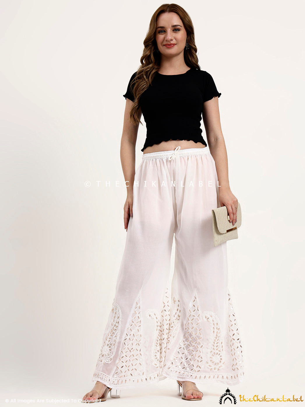 Elegant georgette chikankari sharara with handcrafted embroidery and gota patti work for festive wear.