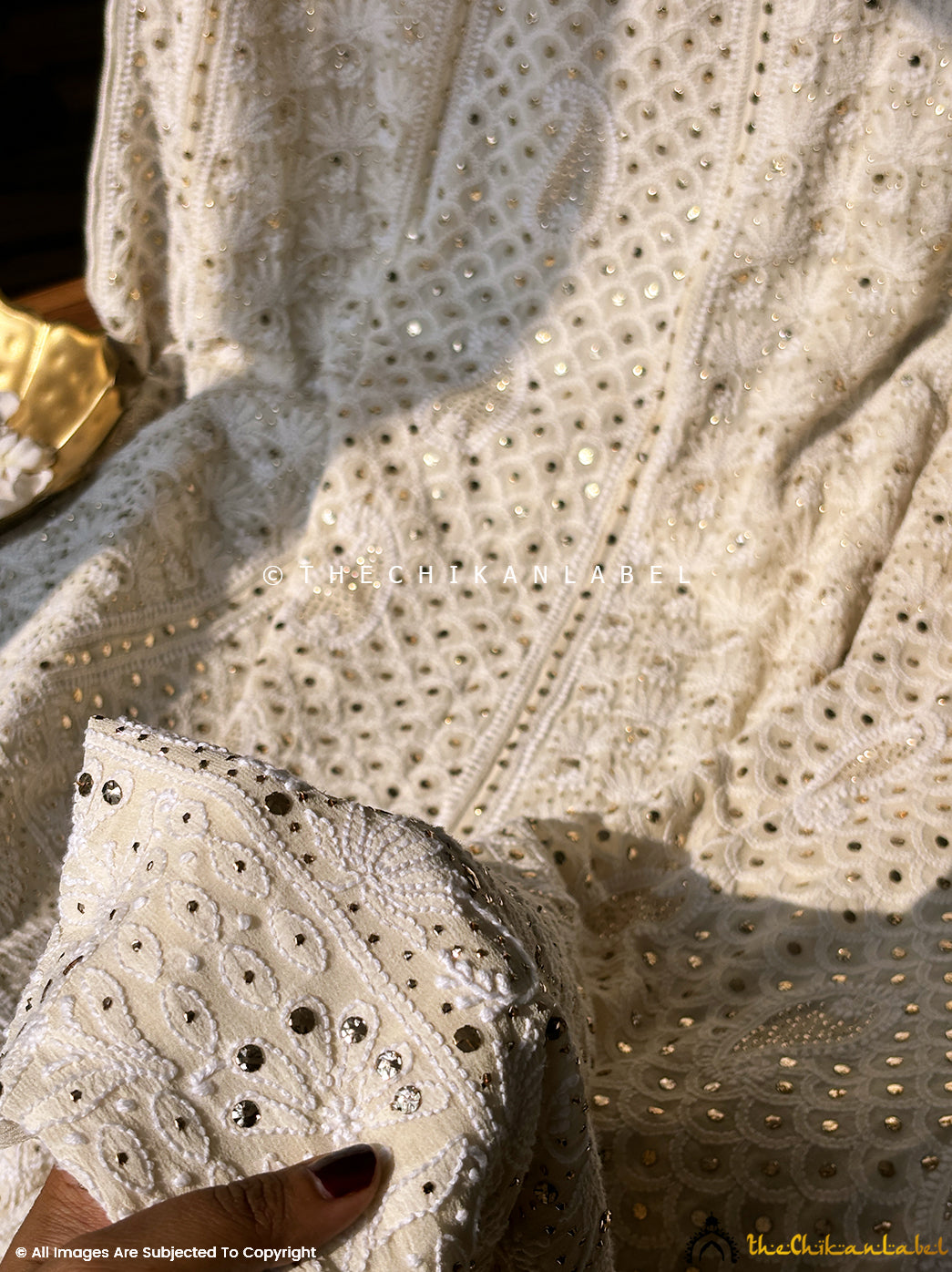 Designer lehenga set with handcrafted chikankari and mukaish highlights, perfect for receptions and wedding celebrations.