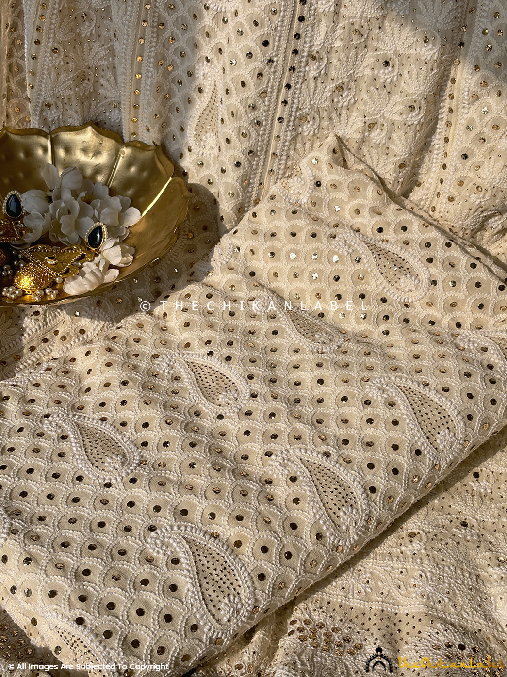 Luxury georgette lehenga set adorned with mukaish handwork and intricate embroidery for timeless ethnic elegance.