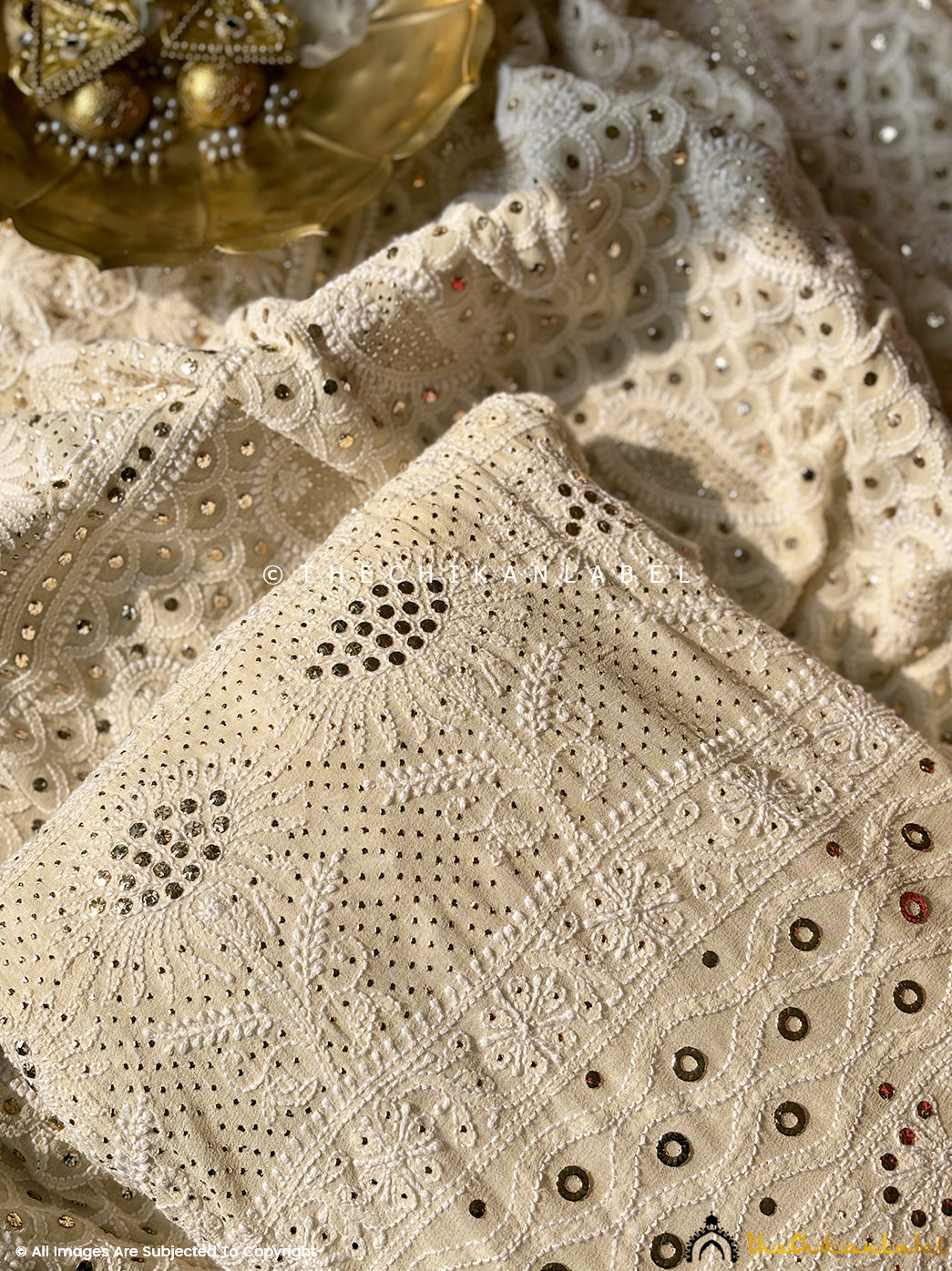 Designer georgette lehenga with mukaish embellishments and hand-embroidered chikankari motifs for luxury festive fashion.