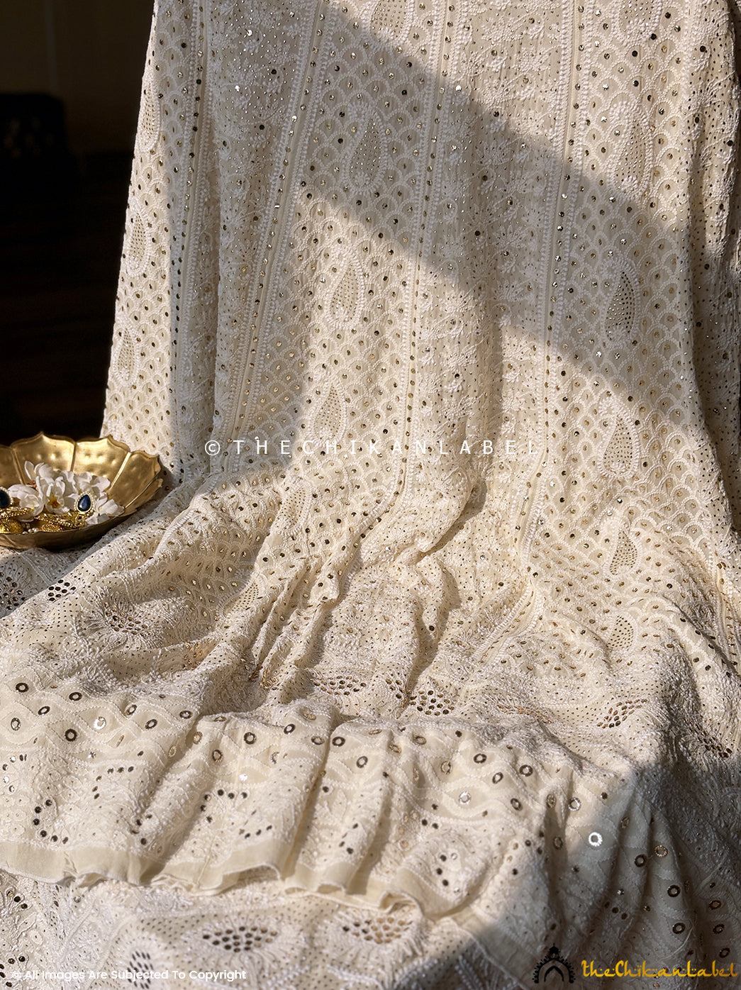 Wedding wear lehenga set featuring delicate chikankari embroidery and mukaish highlights for a regal ethnic look.