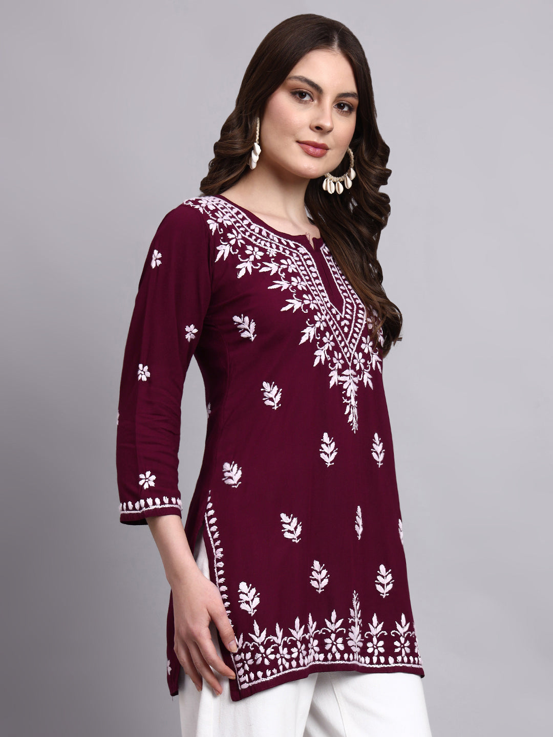 Artisan-made chikankari short kurta with elegant embroidery detailing on neckline and borders