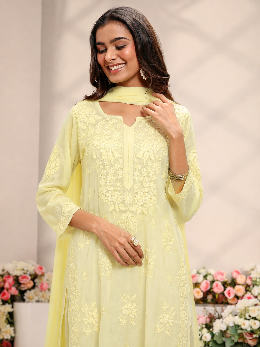 Yamika Muslin Chikankari Straight Kurta Set with Dupatta featuring handcrafted-style embroidery and a breathable relaxed fit ideal for long hours of comfortable wear.