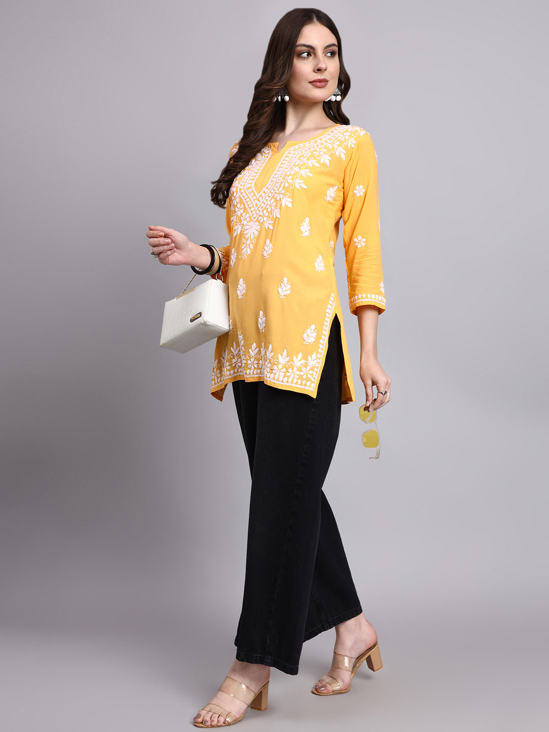 Rayon short kurta with handcrafted chikankari embroidery featuring floral motifs and traditional neckline detailing