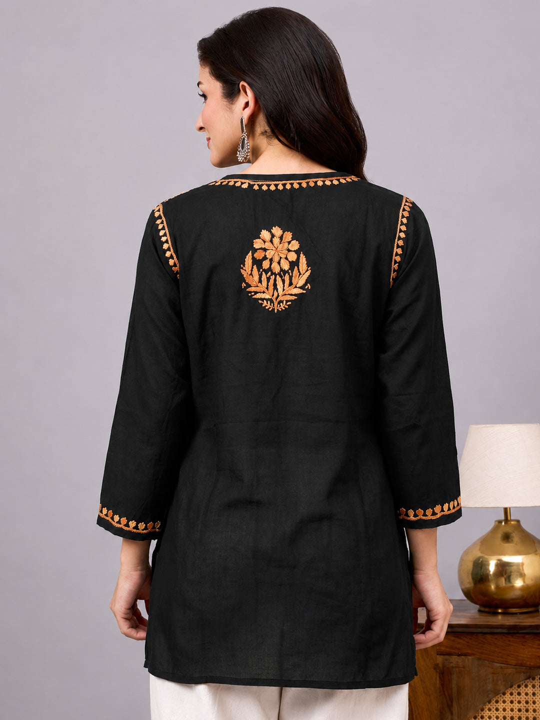 Women’s comfortable regular wear kurta crafted with rayon fabric, elegant Chikankari detailing, and trending short kurta style for graceful dressing