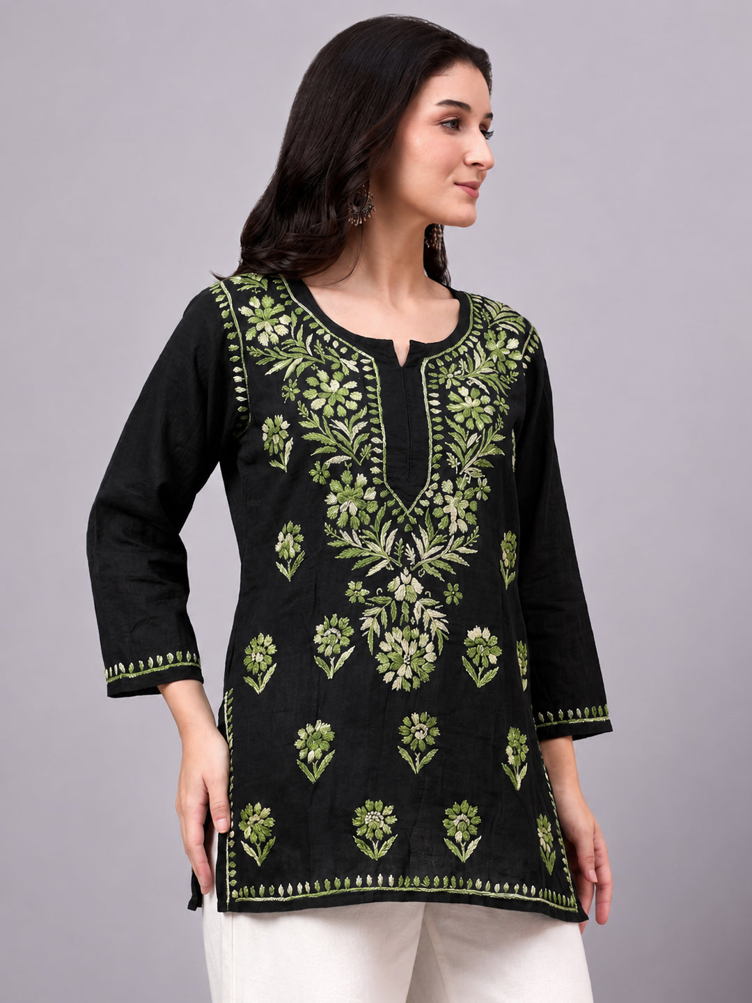 Beautiful Chikankari top crafted from soft rayon fabric with intricate floral embroidery work and comfortable short kurta silhouette for women