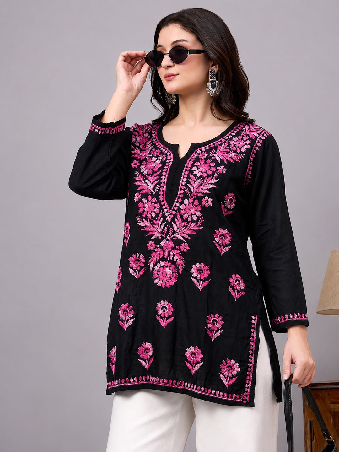 Beautiful Chikankari top crafted from soft rayon fabric with intricate floral embroidery work and comfortable short kurta silhouette for women