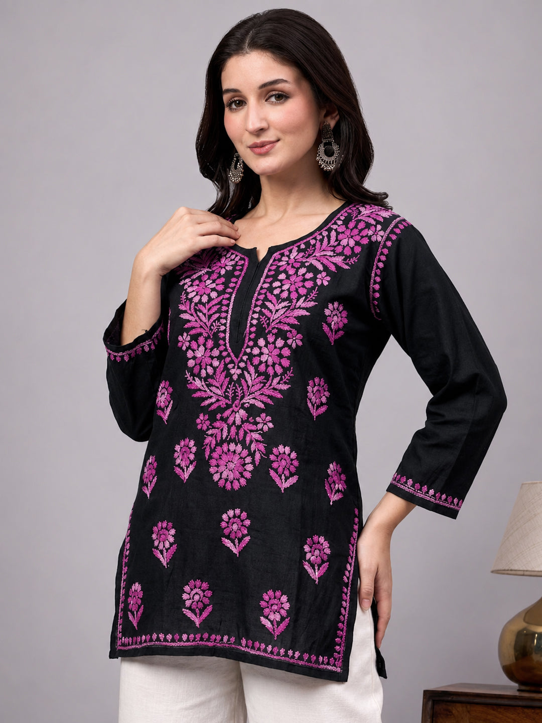Beautiful Chikankari top crafted from soft rayon fabric with intricate floral embroidery work and comfortable short kurta silhouette for women