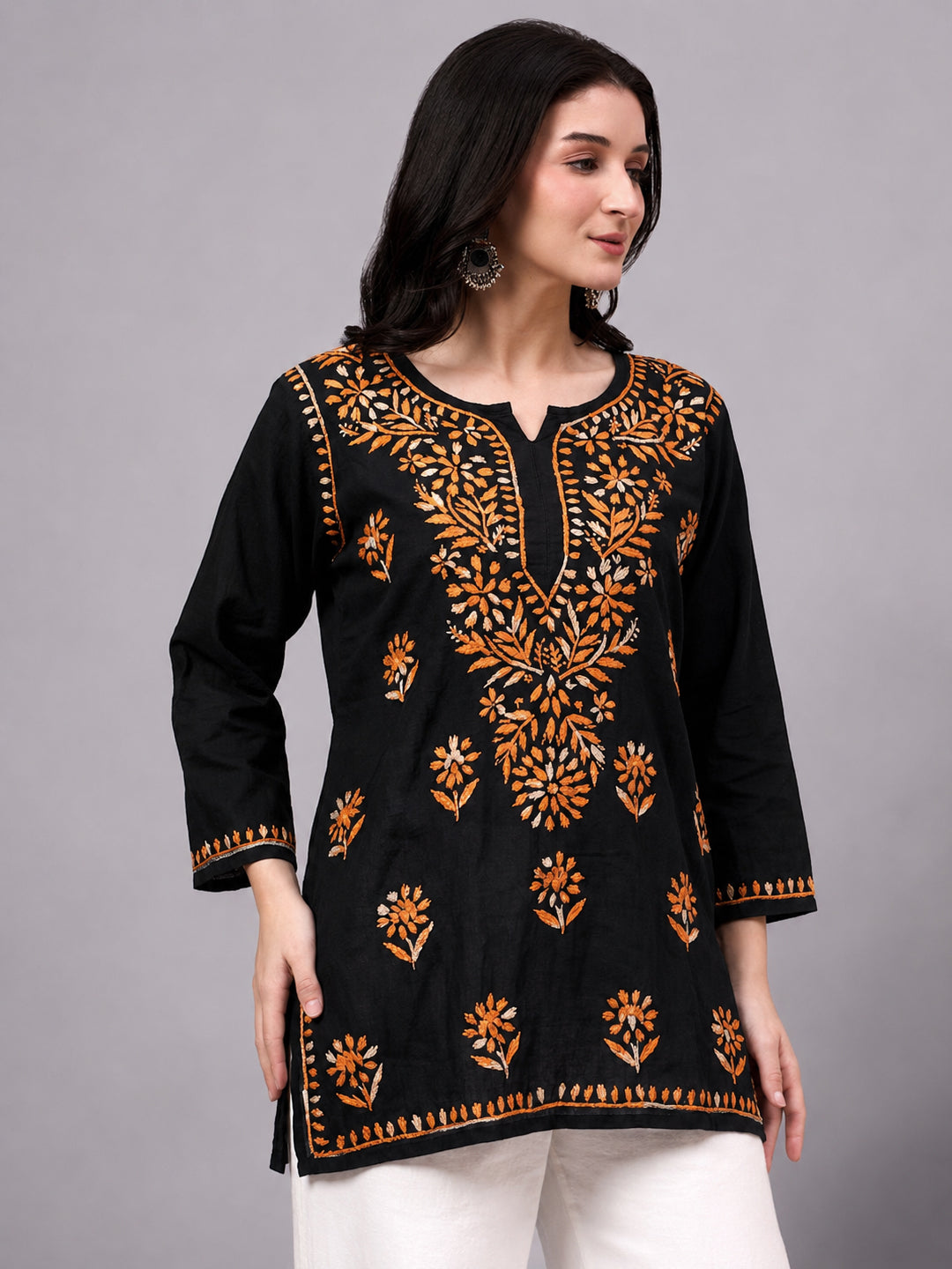 Beautiful Chikankari top crafted from soft rayon fabric with intricate floral embroidery work and comfortable short kurta silhouette for women