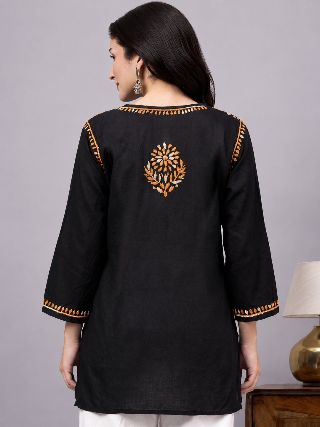 Premium rayon Chikankari short kurta designed with traditional embroidery patterns, lightweight fabric, and modern ethnic fashion styling