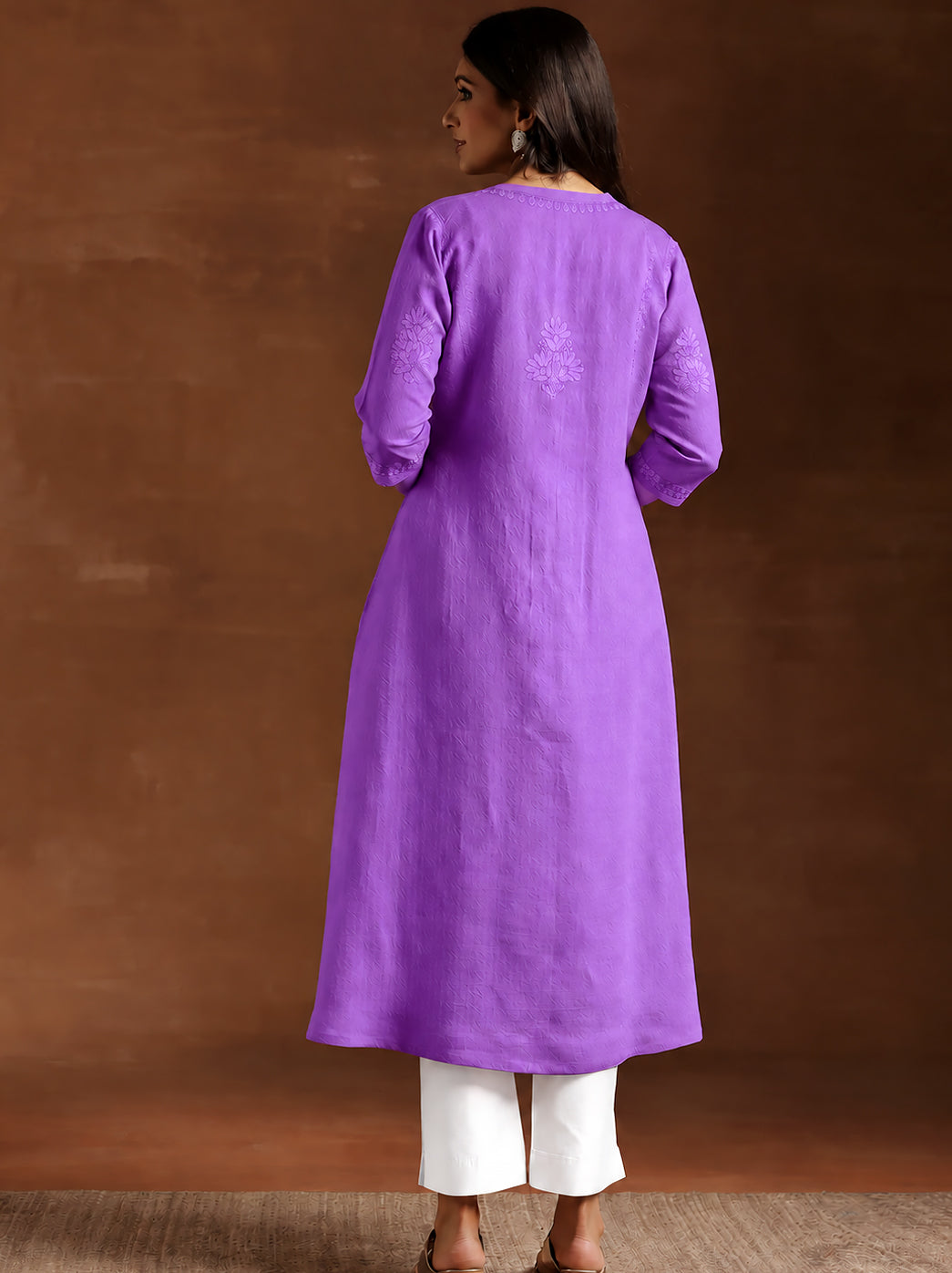 Zara Rayon Straight Kurti for women with intricate embroidery around the neckline, scattered floral motifs and an embroidered hemline border.