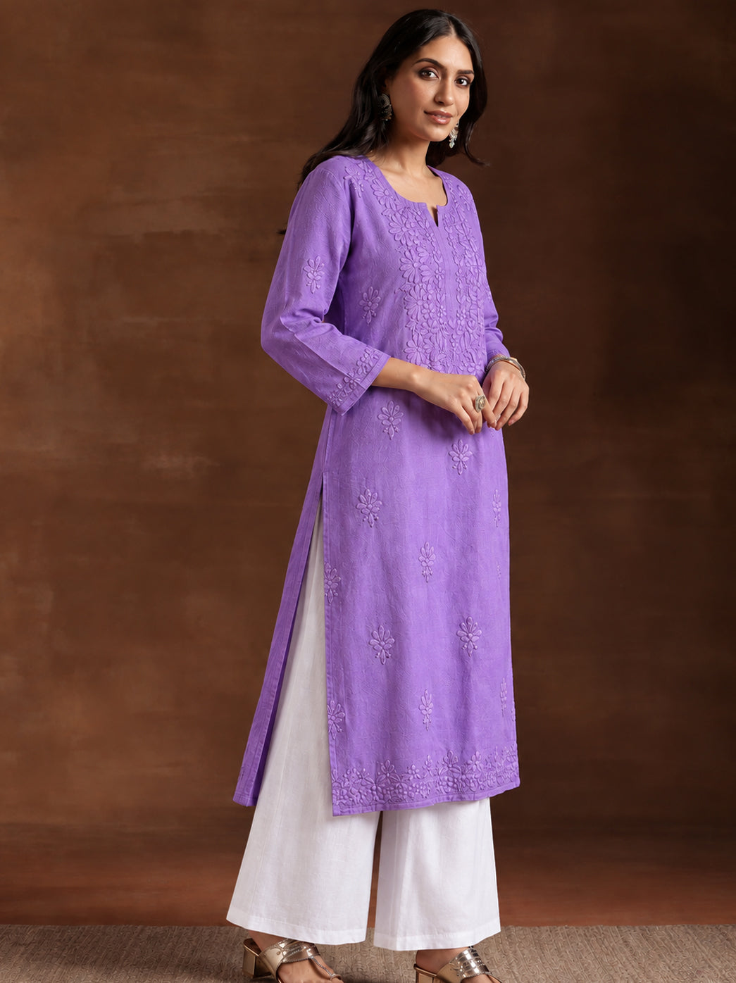 Comfortable regular wear kurti for women featuring a breathable rayon fabric, straight silhouette and elegant floral Chikankari work across the front.