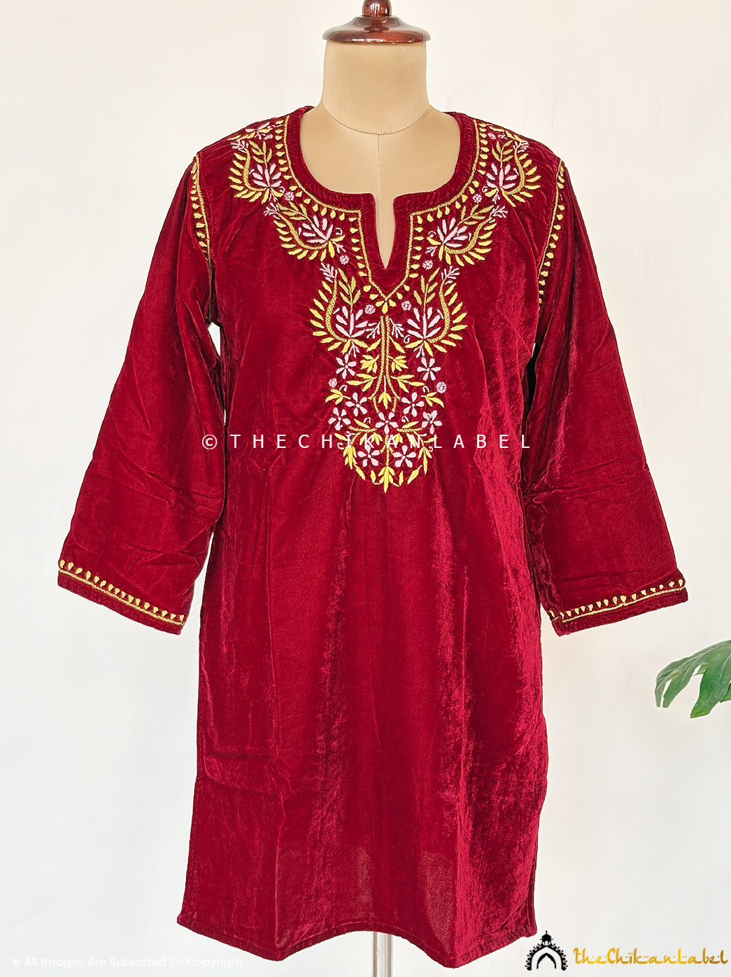 Handcrafted velvet chikankari short kurta with detailed floral patterns designed for winter weddings, festive functions, and evening events.