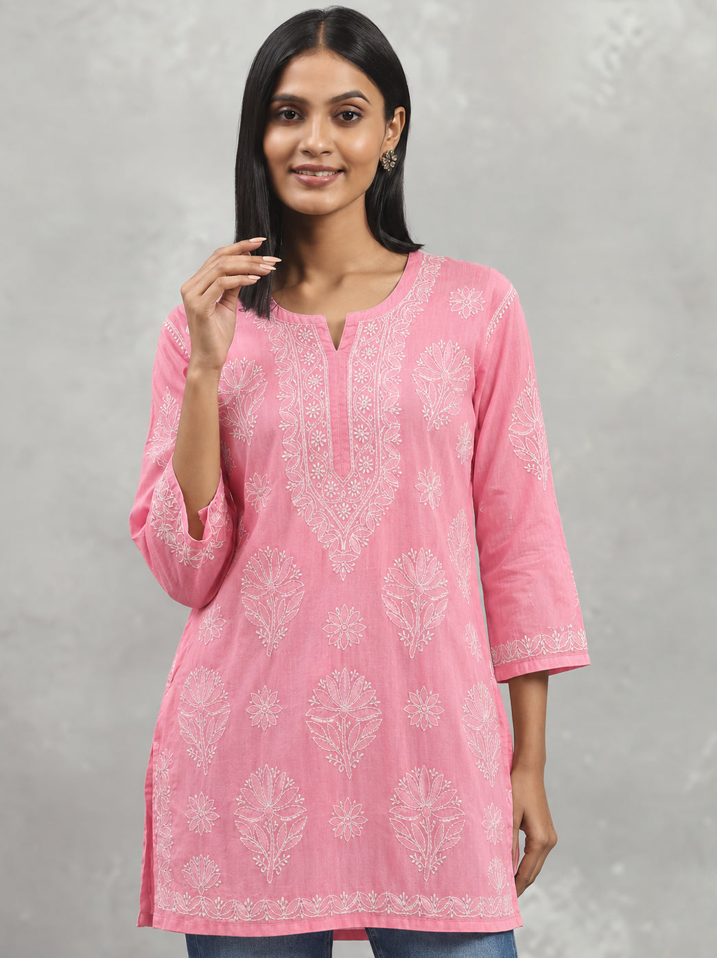Cotton short kurti from The Chikan Label featuring a rounded neck opening, a narrow front notch and a long ornamental Chikankari neckline design.